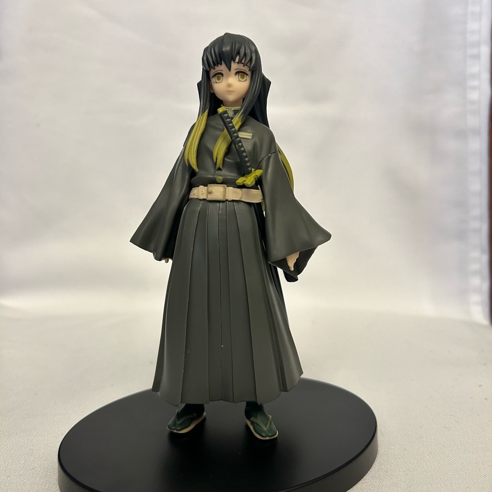 Gray and Green Anime Figure